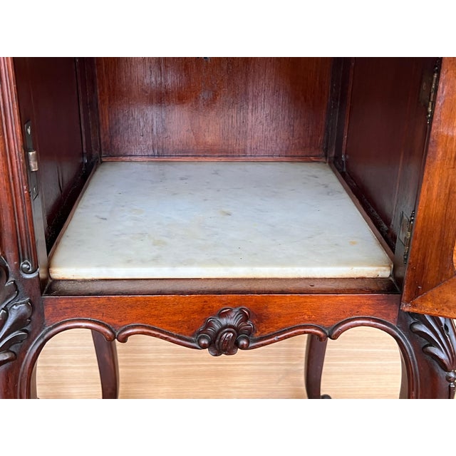Pair of Louis XV style walnut nightstands with marble top, 1930s. Beautiful pair of Louis XV style bedside tables, from...