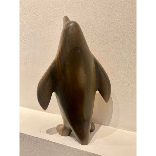 Fun whimsical wooden penguin sculpture in good condition.