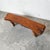 This sculptural organic‑modern bench is carved from a substantial single block of solid wood, giving it a grounded,...