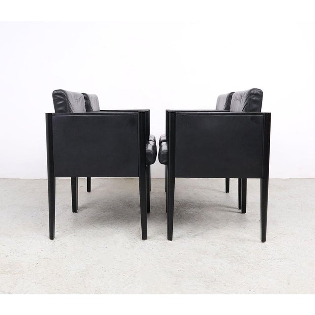 Stylish arco move designer chairs from the 1980s, designed by arnold merckx. the chairs feature black lacquered wood and...