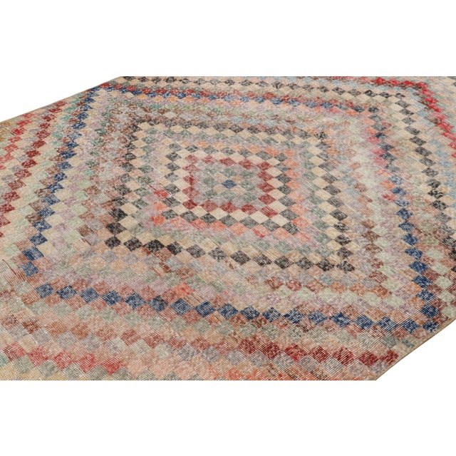 Hand-knotted in wool and originating from Turkey circa 1960 – 1970, this 6x10 vintage Zeki Müren rug is a unique addition...