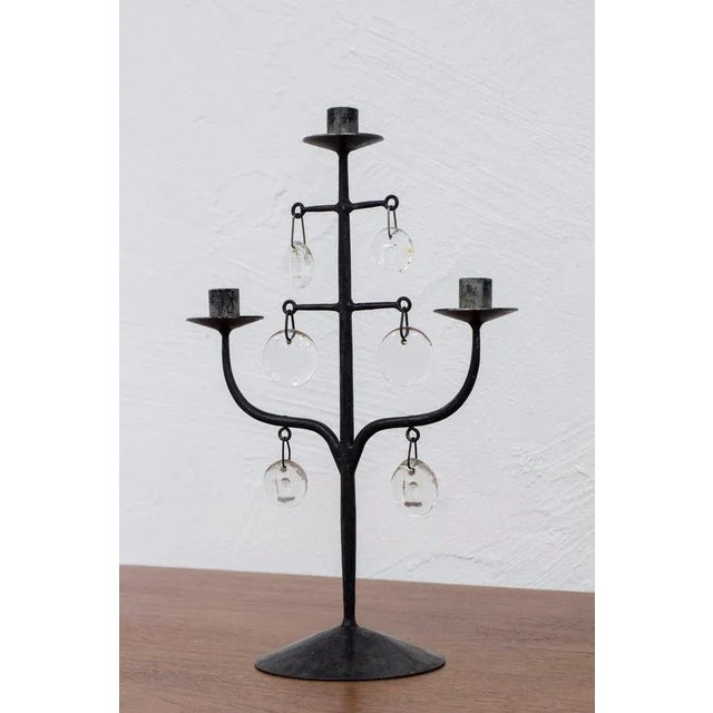 Candelabra designed by Erik Höglund. Made by hand in iron at Boda smide and clear glass prisms from Boda glass. Three arms...