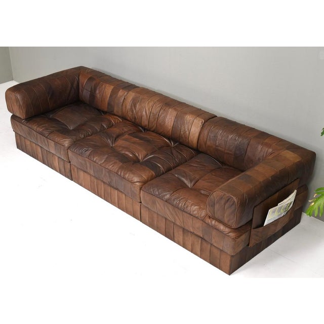 Introducing this gorgeous and rare center piece ds88 element sofa by de sede in cognac brown patchwork leather. 3 seating...