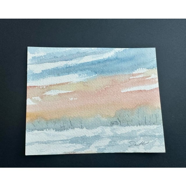 Snow piled high at the structure in the distance. The road leading in is covered with snow. Nancy Smith studied art at...