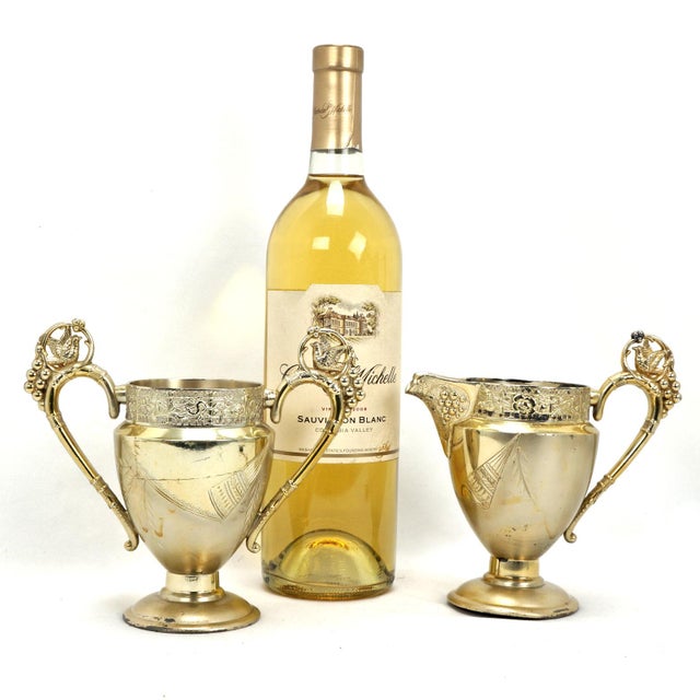 This exquisite Victorian-era Aesthetic Movement silver plate set is a stunning example of late 19th-century artistry,...
