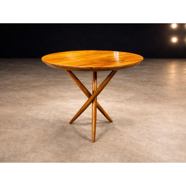 This sculptural three-legged side table, attributed to an unknown Brazilian designer and dating to the early 1950s, is a...