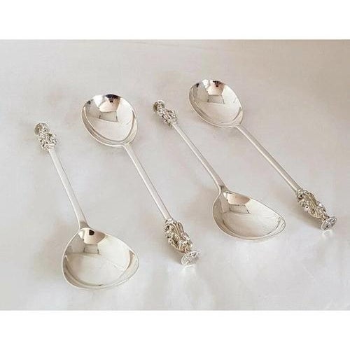 A fine set of four Victorian sterling silver Apostle spoons, hallmarked London 1897 and made by **Josiah Williams & Co.**...