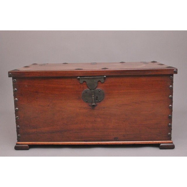 A large 19th Century Anglo Indian mahogany campaign / blanket chest, the hinged top opening to reveal a large compartment...