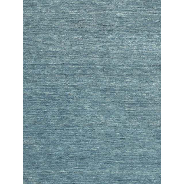 The tribal motifs of this traditional area rug collection reflect the soft pile and unparalleled elegance of classic...