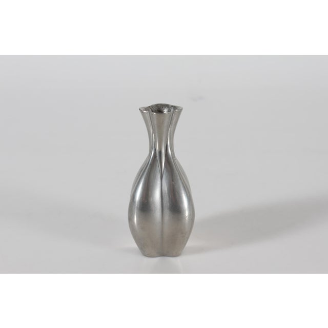 Small decorative Art Deco vase made of polished pewter. It's designed and made by the Danish artist Just Andersen...