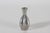 Small decorative Art Deco vase made of polished pewter. It's designed and made by the Danish artist Just Andersen...