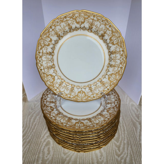 An extraordinary find for the discerning collector or luxury entertainer, this exquisite set of 11 formal dinner plates...
