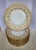 An extraordinary find for the discerning collector or luxury entertainer, this exquisite set of 11 formal dinner plates...