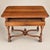 A refined 20th-century Louis XIII style writing table featuring a molded rectangular top, single locking drawer, finely...