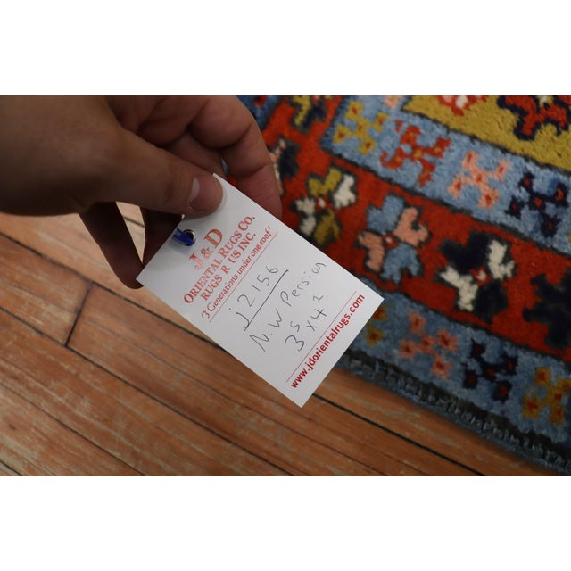 1930s square size geometric northwest Persian Heriz rug with a tribal geometric triple medallion design on a mustard field...