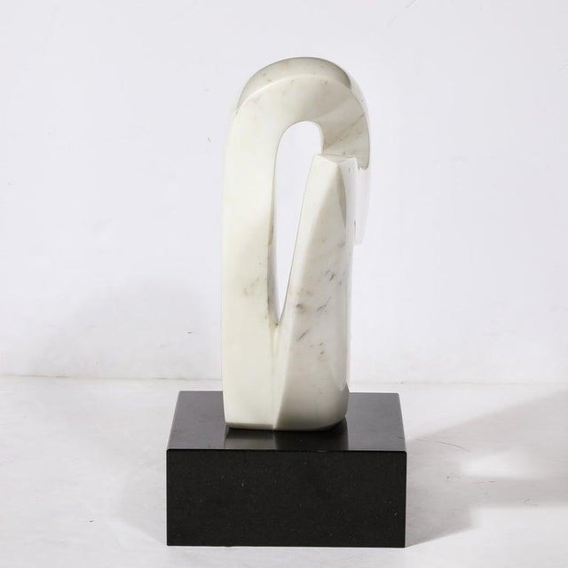 This elegantly bold Mid-Century Modern Carrara Marble Abstract Sculpture originates from the United States, Circa 1970....