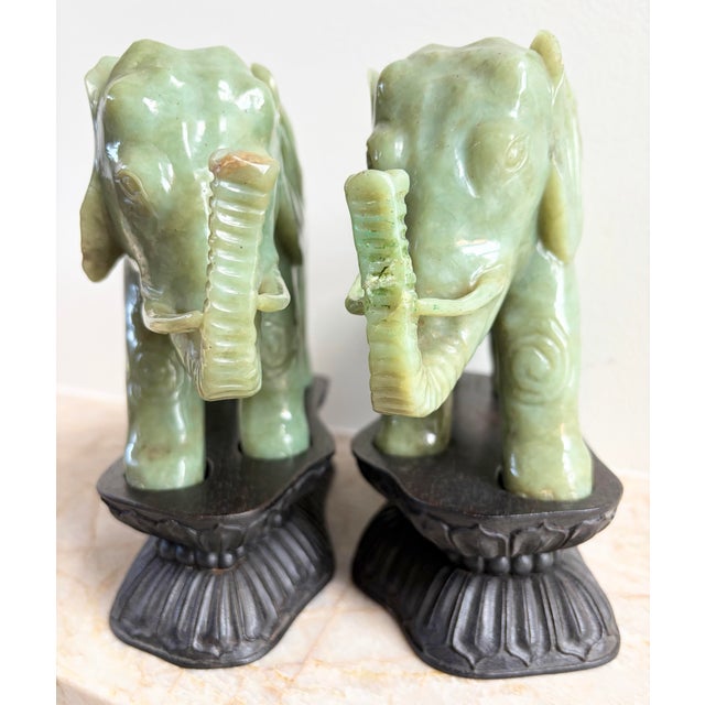 This is a rare pair of Antique Chinese Heavy, Natural Jadeite Jade Elephants with their Custom Stands. Judging from the...