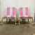 A striking pair of Kent-form accent chairs featuring carved giltwood frames with graceful serpentine aprons and scrolling...