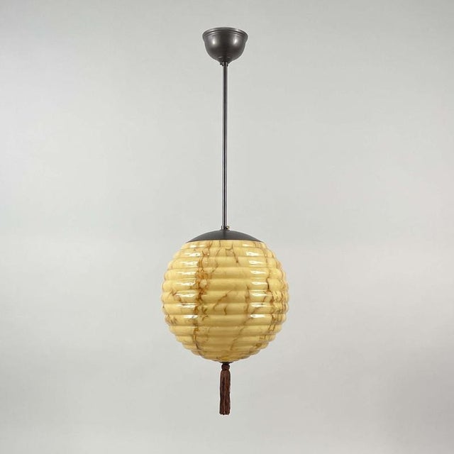 This elegant Art Deco pendant was designed and manufactured in Germany in the 1930s during the Bauhaus period. The light...