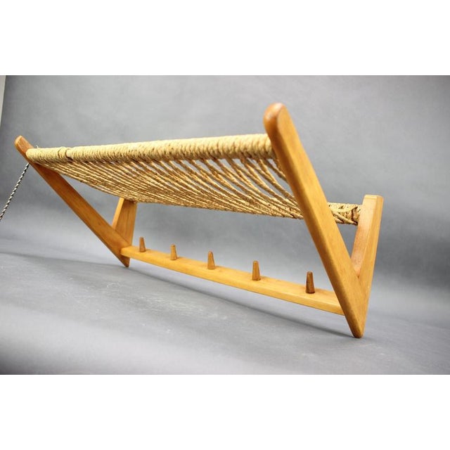 Original Mid-Century wall-mounted coat rack and shelf made in Czechoslovakia during the 1950s. This elegant piece features...