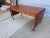 Hans J. Wegner Model 305 Writing Desk with two 18.75 drop-leaves on both ends. Iconic, beautiful and elegant design that...