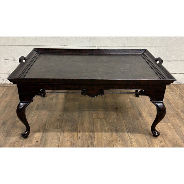 This is a stunning Maitland Smith Chinese Chinoiserie style lacquered coffee table or cocktail table with inlaid incised...