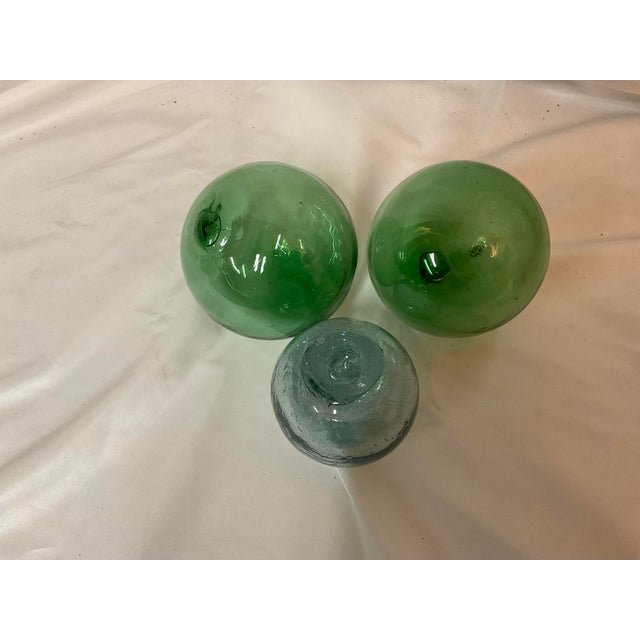 A set of glass orb fishing floats. Some call them witches balls or decorative glass spheres-- what ever you choose to call...