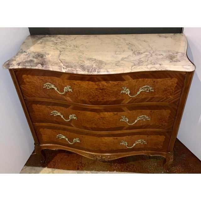 Elegant Antique French Burl Wood Dresser, carved base, three drawers adorning brass ormolu hardware, extinct marble top,...