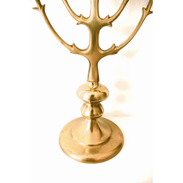 Elevate your style with this sculptural brass Jewish menorah.candelabra / candleholder / Circa 1960. Requires nine...