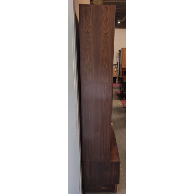High quality Brazilian Rosewood Mid Century Danish Bookcase by Poul Hundevad. Showcases clean lines and minimalist forms....