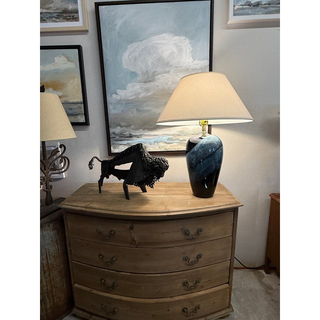 The height of ceramics coming into interior design. Dramatic blue black glaze. This design originated in the mid century...