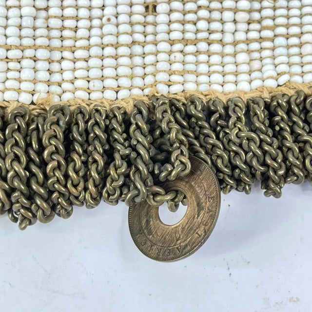 Traditional beaded apron made by the Kamba (Akamba) people of Kenya. Worn by women as part of ceremonial or festive dress,...
