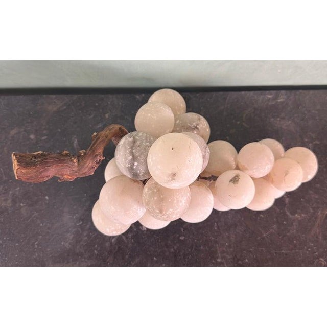 A charming and highly decorative cluster of hand-carved alabaster grapes, mounted on a naturalistic wood vine branch,...