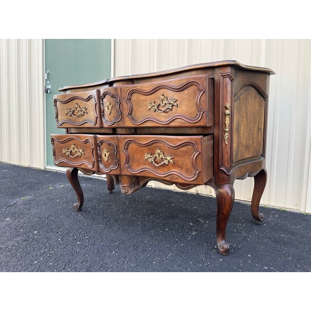 A fantastic two drawer walnut chest of drawers or commode dresser made by renowned American furniture maker, Baker...