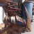 Hand Painted Cowboy Sculpture With Bucking Bronco on Stool Art Statue For Sale - Image 4 of 9