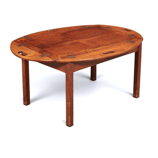 This is a classic adaptation of an English 19th Century Oak Butler's Tray to a 20th century tray on stand informal coffee...
