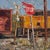 Stop by Clyde Steadman | Oil Painting of a stop sign near a train and railroad tracks For Sale