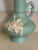 Vintage Weller Pottery Urn Vase Green White Flowers. Naturaly occurring blemish near rear of mouth. Bottom near signature...