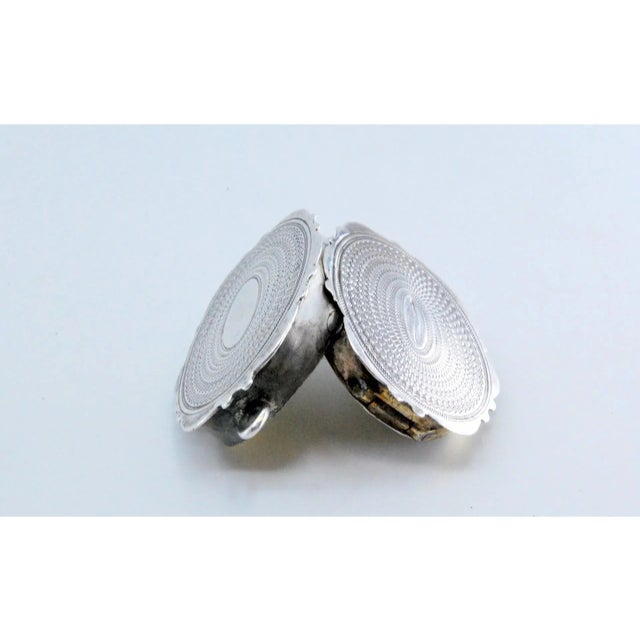 Edward VII Oval Silver and Gold Vinaigrette Box with Engravings, in Very Good conditions. Designed before 1890 This piece...