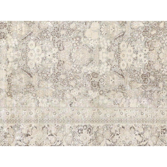 Experience the beauty and richness of an Antique Persian Tabriz Rug - 7'2" x 11'1". Handcrafted with intricate details and...