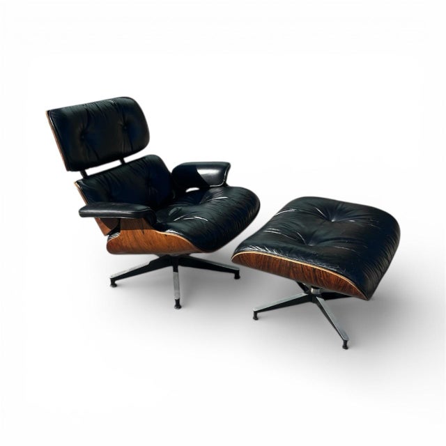 An authentic Herman Miller Eames Lounge Chair and matching Ottoman, an enduring icon of mid-century modern design...