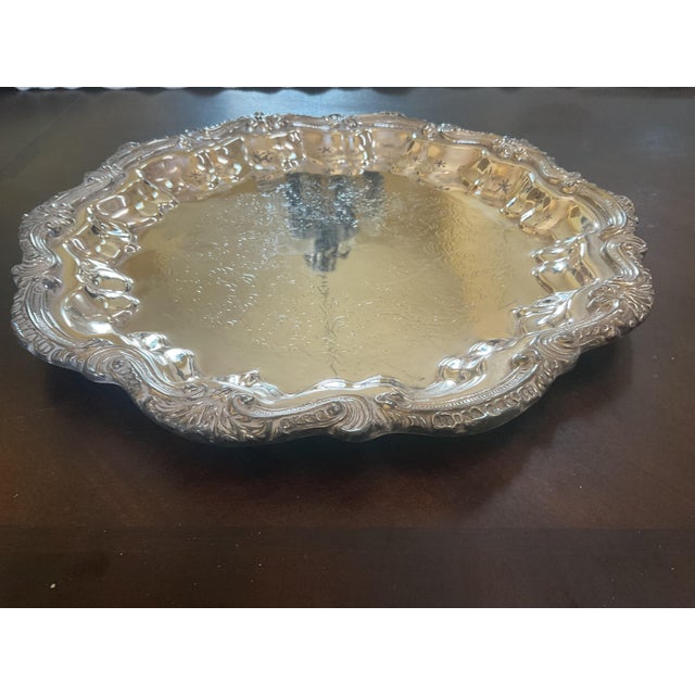 Mid 20th Century silver tray with scalloped edges and detailed engraving throughout the item,