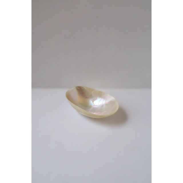 A natural oval mother of pearl bowl or dish, a great vessel to hold caviar, etc., in the Organic Modern style, circa...
