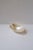 A natural oval mother of pearl bowl or dish, a great vessel to hold caviar, etc., in the Organic Modern style, circa...