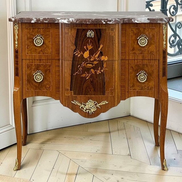Inspired by the great tradition of eighteenth century French cabinetmaking, this elegant commode brings together finely...