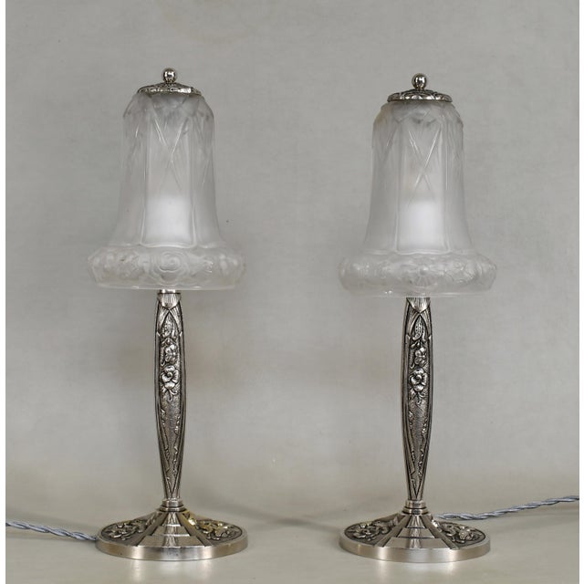 LORRAIN DAUM A pair of French art deco table lamps made circa 1926-1933. The nickel-plated bases in solid brass or bronze...