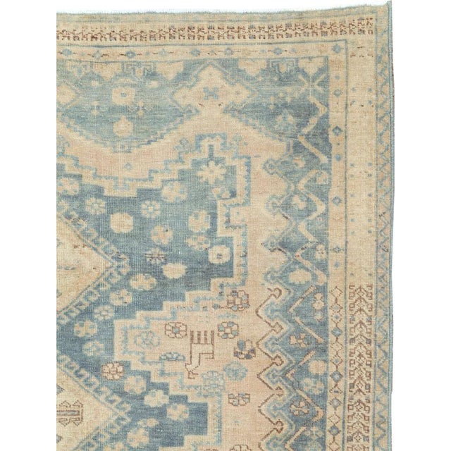 This mid-20th-century Persian Afshar accent rug presents a softly geometric composition in pale blue, ivory, beige, sand,...
