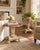 A decorative pair of vintage Katherine Henick side tables or plant stands, each featuring a scalloped gilt-finished top,...