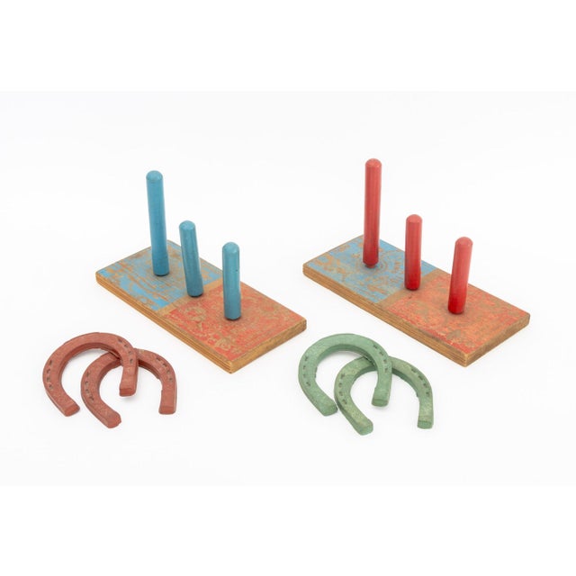 Collection of American Toys and Games, including: rubber horseshoe game, rattles, and polychrome painted wood blocks....