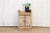 A rustic reclaimed teak nightstand cabinet, boasting a charming bleached finish. Crafted from an antique window door, this...